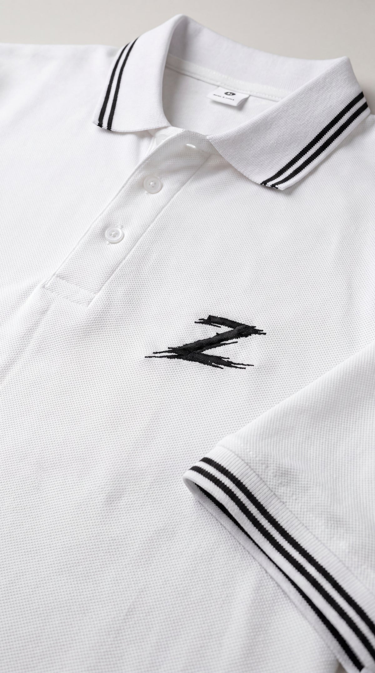 Signature Z Polo Shirt in Pure White - collar and embroidery detail